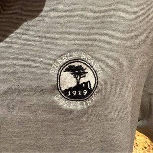 Travis Mathew men’s Pebble Beach golf polo. Sharp grey w/iconic PB logo.